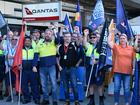 Qantas engineers and supporters participate in rally during a protest over wages at Brisbane Qantas Domestic Terminal in Brisbane, Monday, September 30, 2024. More than a thousand Qantas engineers are planning to escalate their industrial action with line maintenance engineers walking off the job during peak-hour flights on Monday morning. (AAP Image/Darren England