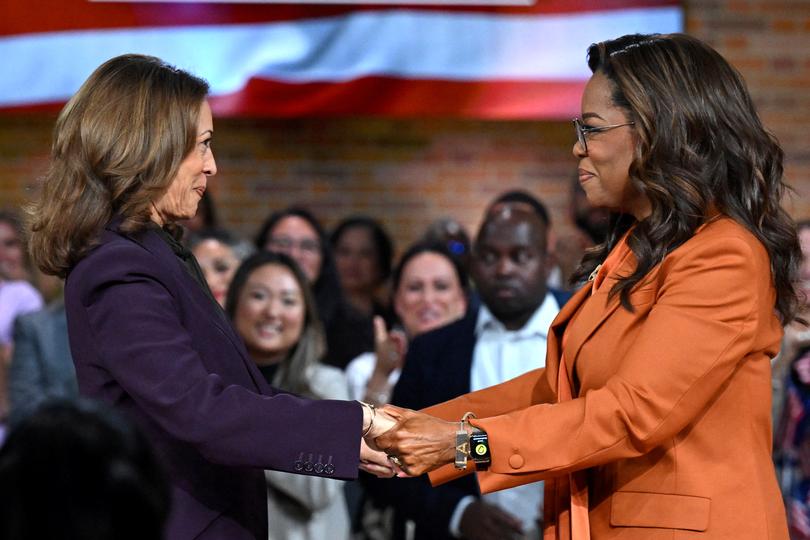 US Vice President and Democratic presidential candidate Kamala Harris (L) joins US television producer Oprah Winfrey at a 'Unite for America' live streaming rally in Farmington Hills, Michigan, on September 19, 2024. (Photo by SAUL LOEB / AFP)