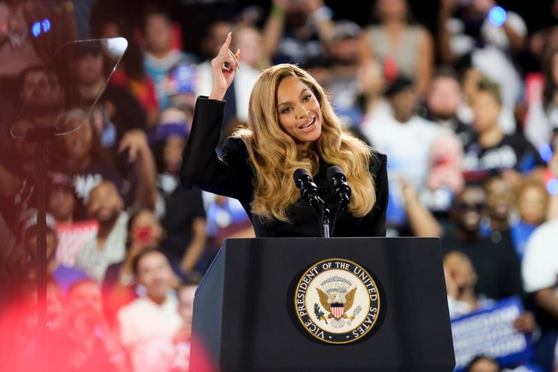 Singer Beyonce talks to the crowd at the rally in Houston.