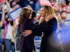 US Vice President Kamala Harris greets singer Beyonce as fellow star Kelly Roland looks on.