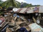 A major rescue effort is underway in the Philippines after a tropical storm caused major landslides. (AP PHOTO)