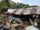 A major rescue effort is underway in the Philippines after a tropical storm caused major landslides. (AP PHOTO)