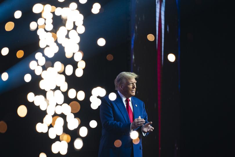 Former president Donald Trump walks out to speak at a Turning Point Action rally in Duluth, Georgia, on Wednesday. 