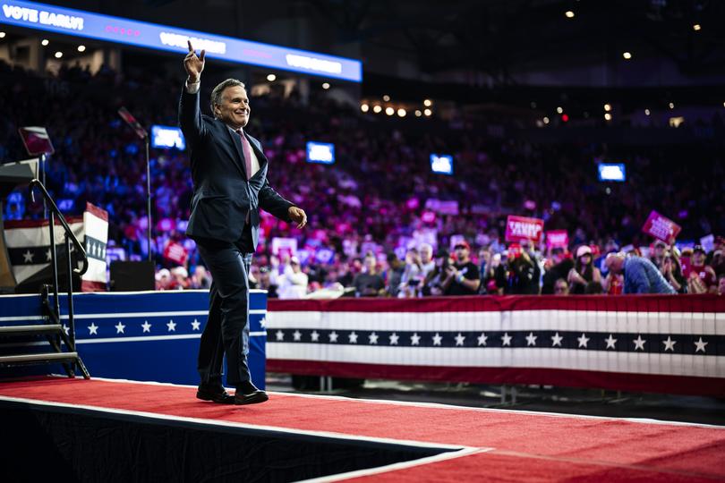 Dave McCormick, a candidate for the Senate from Pennsylvania, walks out to speak at a rally for former president Donald Trump in Reading on Oct. 9. 