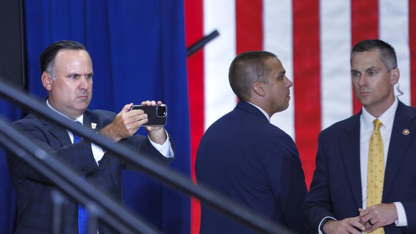 Trump campaign communications adviser Dan Scavino takes photos of the audience at a July 27 campaign rally in St. Cloud, Minnesota. 