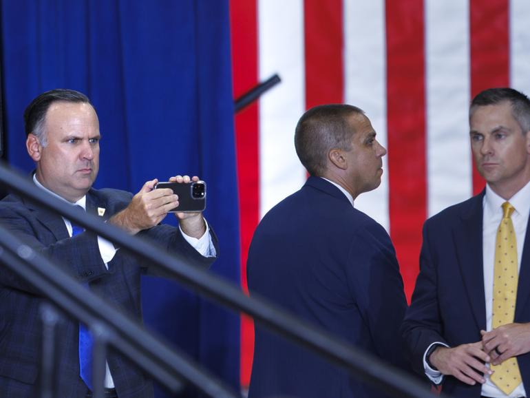 Trump campaign communications adviser Dan Scavino takes photos of the audience at a July 27 campaign rally in St. Cloud, Minnesota. 