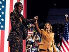 Former first lady Michelle Obama and Vice President Kamala Harris acknowledge an enthusiastic crowd in Kalamazoo, Michigan. 