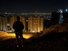 Looking out over Tehran after hearing the sound of explosions on Saturday, Oct. 26, 2024. IsraelÕs retaliatory attack on Iran on Saturday morning marked the start of a new and more dangerous phase in the two countriesÕ yearslong conflict, but it appeared, at least for now, to have stopped short of prompting an all-out war, analysts said. (Arash Khamooshi/The New York Times)