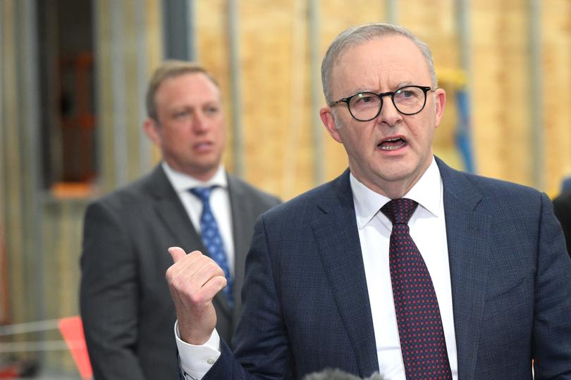 Prime Minister Anthony Albanese (right) and Queensland Premier of Queensland Steven Miles (left) are seen during a visit to Queensland University of Technology Advanced Battery Facility in Banyo, Brisbane, Thursday, May 23, 2024. (AAP Image/Darren England) NO ARCHIVING