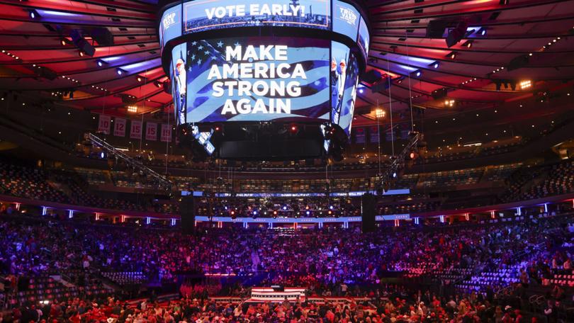 People arrive to Madison Square Garden before Republican presidential candidate and former US president Donald Trump holds a rally at the venue in New York.