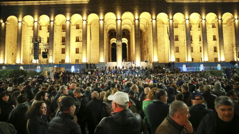 Demonstrators gather at the Georgian Parliament building during an opposition protest against the results of the parliamentary election in Tbilisi, Georgia.