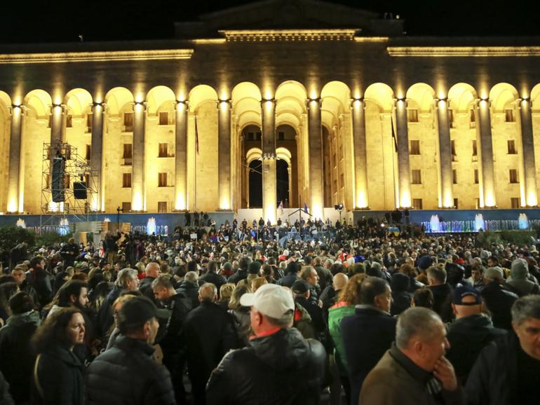 Demonstrators gather at the Georgian Parliament building during an opposition protest against the results of the parliamentary election in Tbilisi, Georgia.