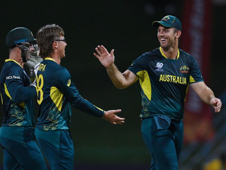 Adam Zampa celebrates with teammates Matthew Wade and Mitchell Marsh during the T20 Cricket World Cup.