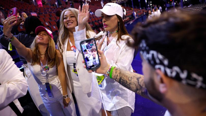 Social media influencers producing content during the final day of the 2024 Democratic National Convention in Chicago.