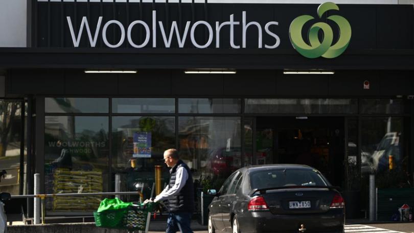 Woolworths has flagged a lower first-half profit.