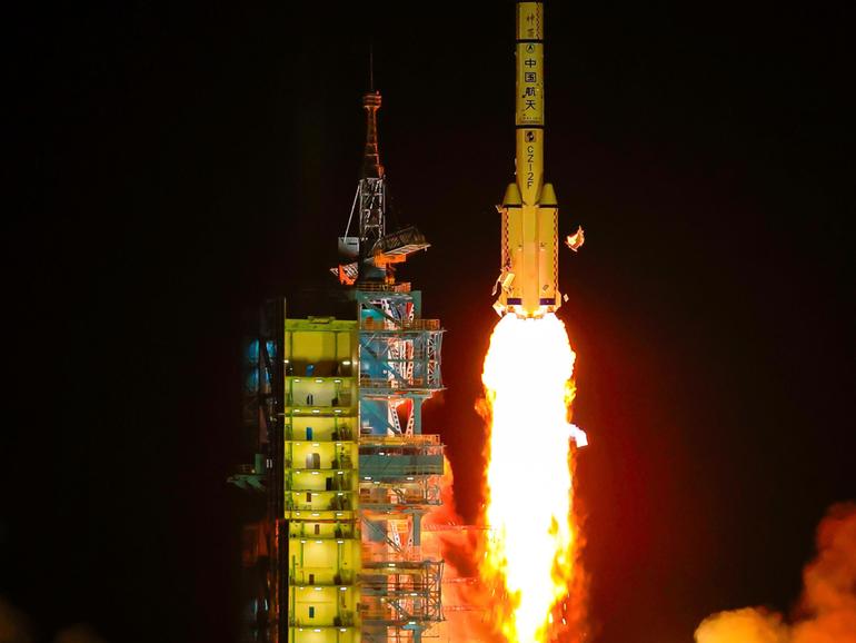 A Long March 2-F carrier rocket blasts off with China’s Shenzhou-19 crewed spaceship.