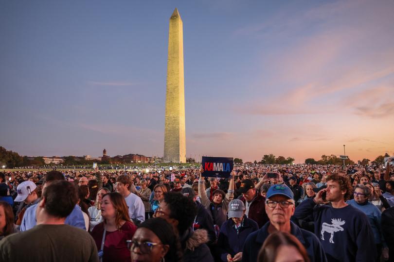 Supporters of US Vice President and Democratic presidential candidate Kamala Harris gather near the Washington Monument to hear her speak on The Ellipse, just south of the White House, in Washington, DC, on October 29, 2024. The Harris-Walz campaign is billing the speech as "a major closing argument" one week before the November 5 election. (Photo by Amid Farahi / AFP) (Photo by AMID FARAHI/AFP via Getty Images)