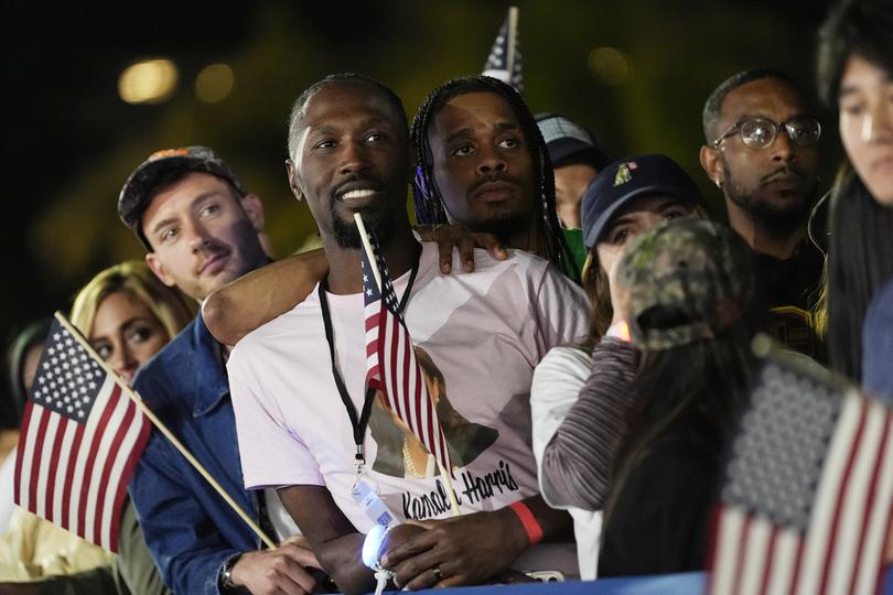 Supporter listening to Democratic presidential nominee Vice President Kamala Harris speaking during a campaign event at the Ellipse near the White House in Washington, Tuesday, Oct. 29, 2024. (AP Photo/Jacquelyn Martin)