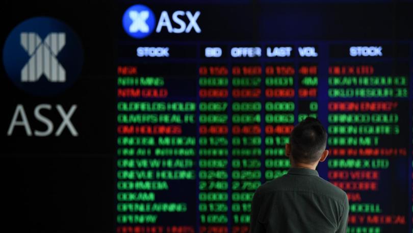 Miners, property trusts and IT shares had risen while other ASX sectors were in the red at midday. (Joel Carrett/AAP PHOTOS)