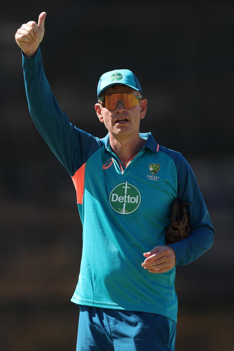 Andrew McDonald, head coach of Australia gestures to the players rooms.