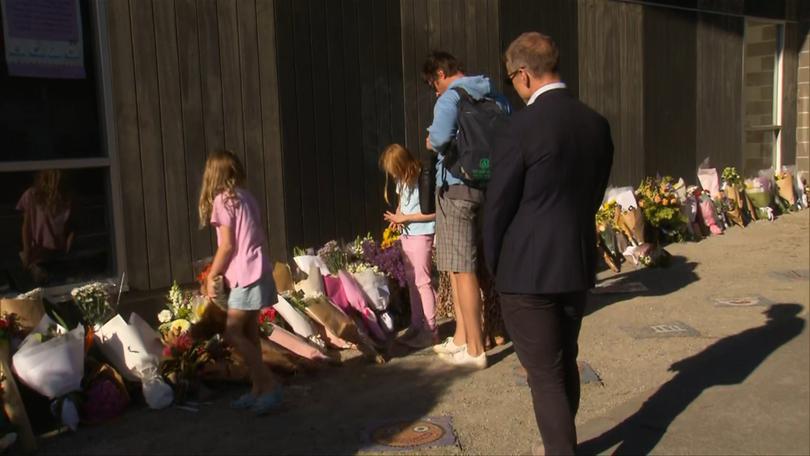 Jack’s father wore his son’s backpack and his sisters left teddy bears.