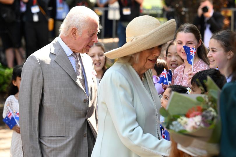 Charles and Camilla greet people as they arrive for a visit to St Thomas' Anglican Church.