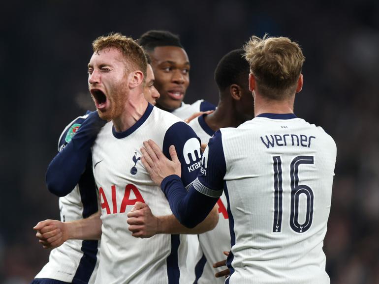 Dejan Kulusevski of Tottenham Hotspur celebrates after teammate Pape Matar Sarr scores their team's second goal during the Carabao Cup Fourth Round match between Tottenham Hotspur and Manchester City at Tottenham Hotspur Stadium.