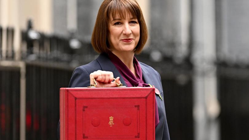 Chancellor of the Exchequer, Rachel Reeves, poses with the red Budget Box as she leaves 11 Downing Street.