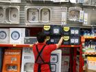 A bunnings worker stacks shelves at the hardware store