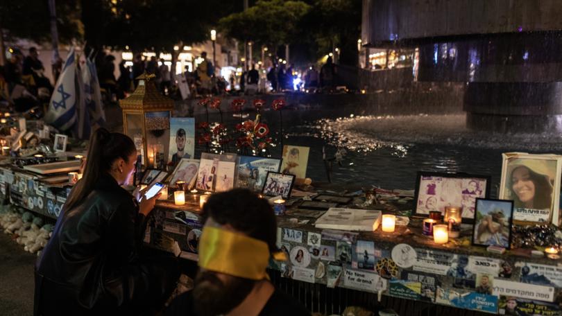 Activists, many blindfolded, demonstrate Thursday in Tel Aviv in protest of the celebration of the Jewish holiday of Simchat Torah while hostages are still held in Gaza. 