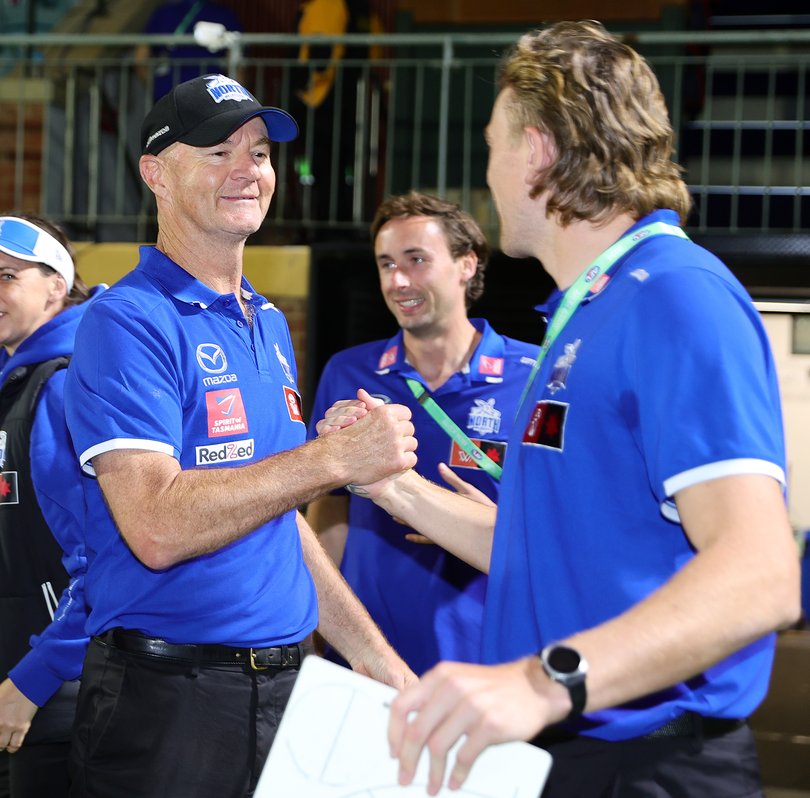 Darren Crocker with Hugh Greenwood during the 2024 AFLW Round 09 match between Kuwarna (Adelaide Crows) and the North Melbourne Kangaroos.