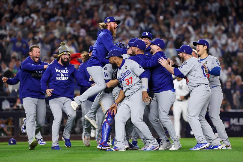 NEW YORK, NEW YORK - OCTOBER 30: The Los Angeles Dodgers celebrate as the they defeat the New York Yankees 7-6 in game 5 to win the 2024 World Series at Yankee Stadium on October 30, 2024 in the Bronx borough of New York City. (Photo by Elsa/Getty Images) *** BESTPIX ***