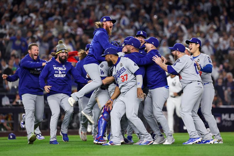 NEW YORK, NEW YORK - OCTOBER 30:  The Los Angeles Dodgers celebrate as the they defeat the New York Yankees 7-6 in game 5 to win the 2024 World Series at Yankee Stadium on October 30, 2024 in the Bronx borough of New York City. (Photo by Elsa/Getty Images) *** BESTPIX ***