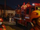 About 20 firefighting trucks are at the site of a large fire at a cooking oil factory near Jakarta. 