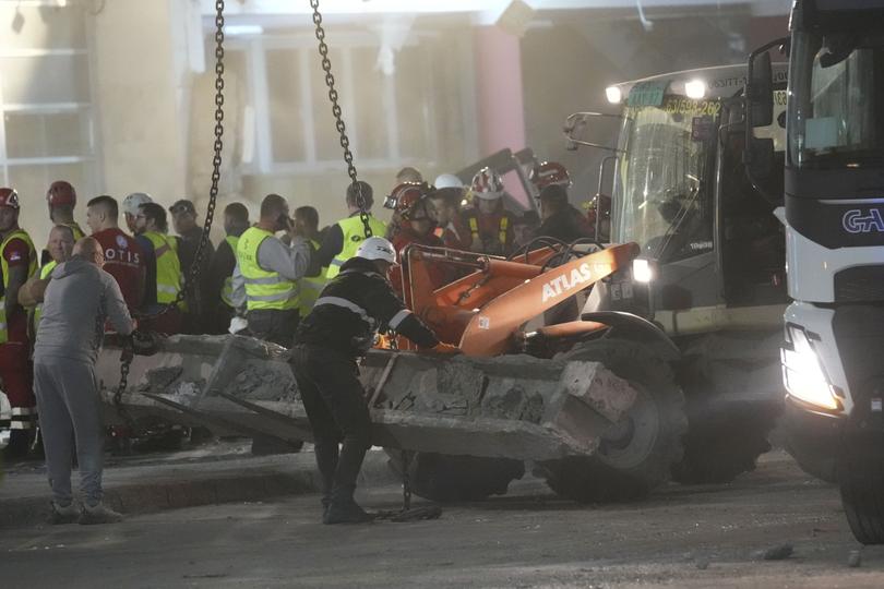 Rescue workers search for victims.