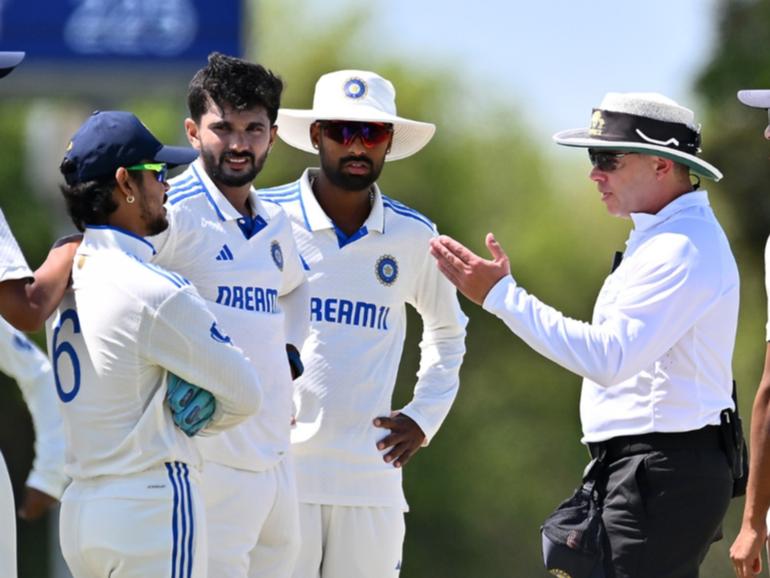 India A players speak with the umpire Shawn Craig.