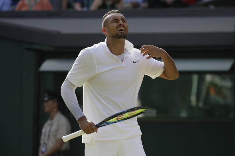 Australia's Nick Kyrgios reacts after losing a point against Spain's Rafael Nadal in a Men's singles match during day four of the Wimbledon Tennis Championships in London, Thursday, July 4, 2019. (AP Photo/Kirsty Wigglesworth)