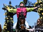 Jockey Robbie Dolan celebrates after riding Knights Choice to victory in the the 2024 Melbourne Cup at Flemington Racecourse in Melbourne, Tuesday, November 5, 2024. (AAP Image/James Ross) NO ARCHIVING, EDITORIAL USE ONLY