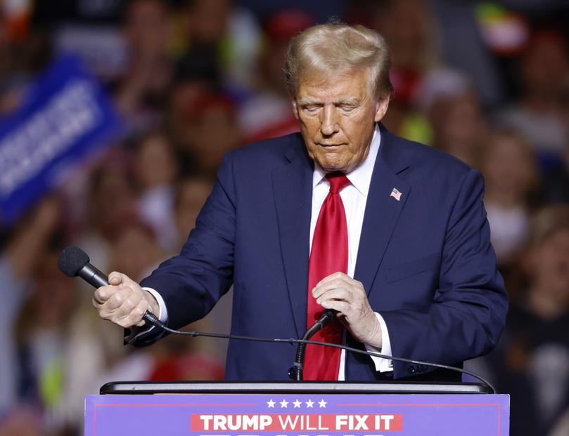 epa11696820 Republican presidential candidate Donald J. Trump wrestles with a microphone during a campaign event at Fiserv forum in Milwaukee, Wisconsin, USA, 01 November 2024. Trump is running against Democratic presidential candidate US Vice President Kamala Harris and the United States will hold its election on 05 November 2024. EPA/JEFFREY PHELPS