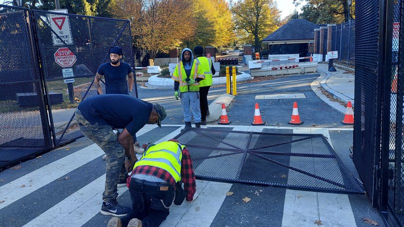 Extra fencing is installed at the Naval Observatory on Sunday. 