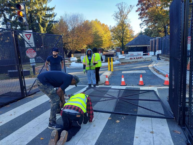 Extra fencing is installed at the Naval Observatory on Sunday. 