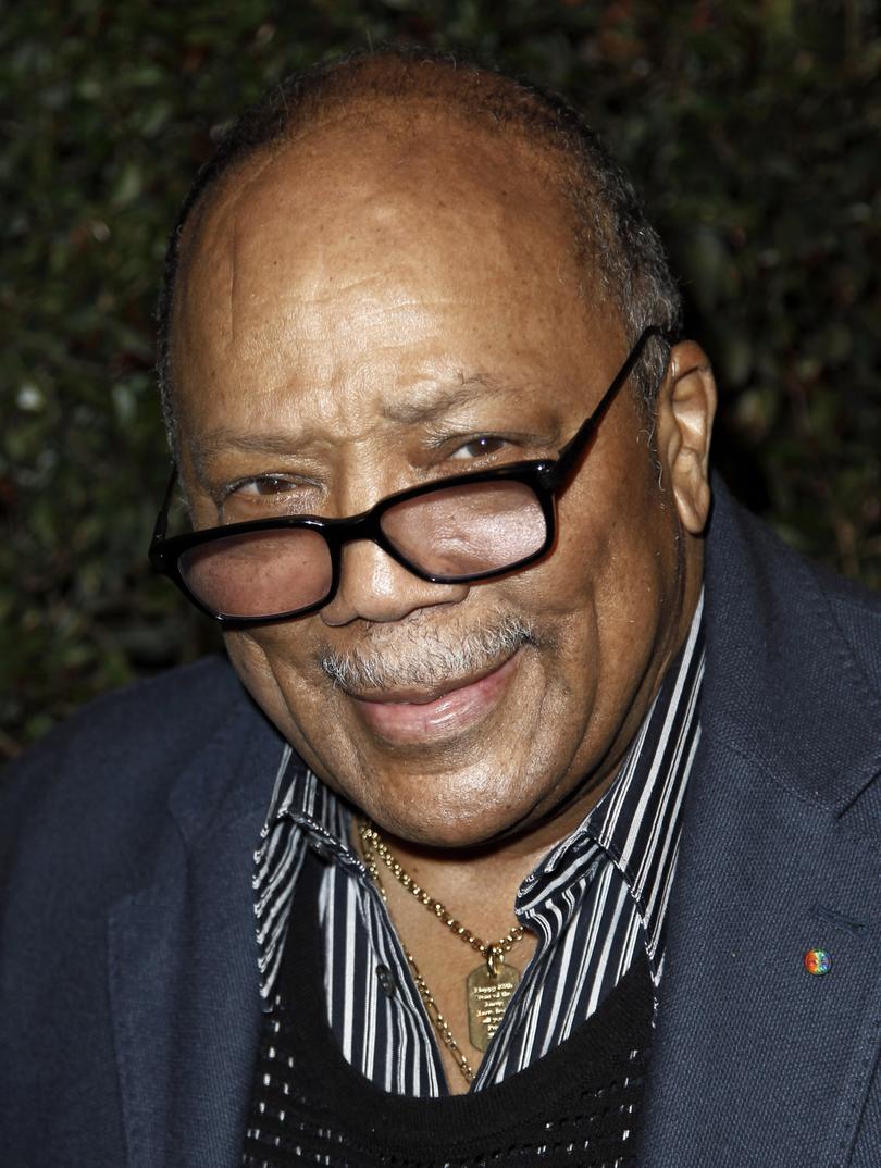 FILE - Quincy Jones arrives at the world premiere of the music video for Paul McCartney's song, "My Valentine", in West Hollywood, Calif., in this April 13, 2012 file photo. Jones sued Jackson's estate on Friday, Oct. 25, 2013, claiming that he was owed millions in royalties and fees on music that's been used in post-death Jackson projects including the "This Is It" concert film. Jones produced Jackson's "Off the Wall," "Thriller" and "Bad" albums. (AP Photo/Matt Sayles, File)