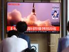 People watch a TV showing a file image of a North Korean missile launch in Seoul in 2021.