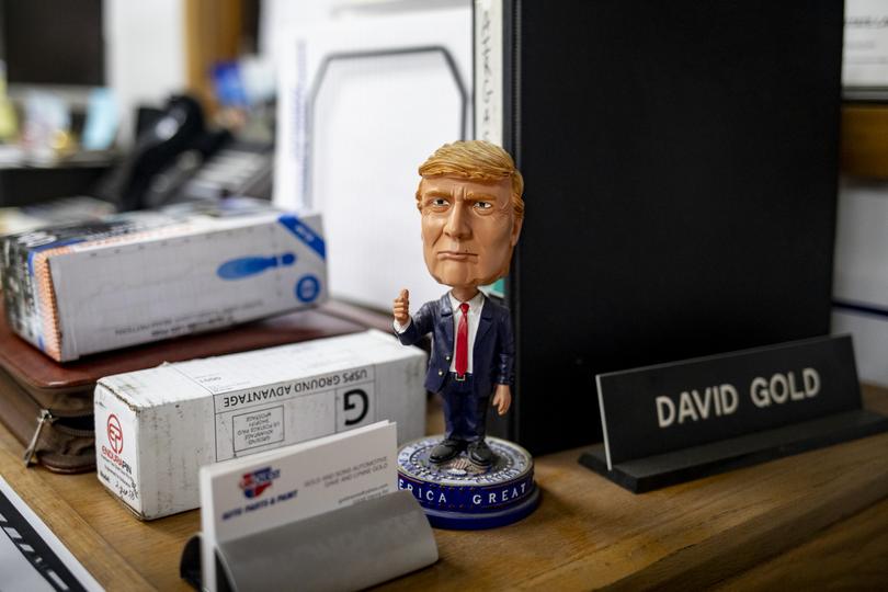 A bobblehead that was a gift from David Gold’s son sits on his office desk. 