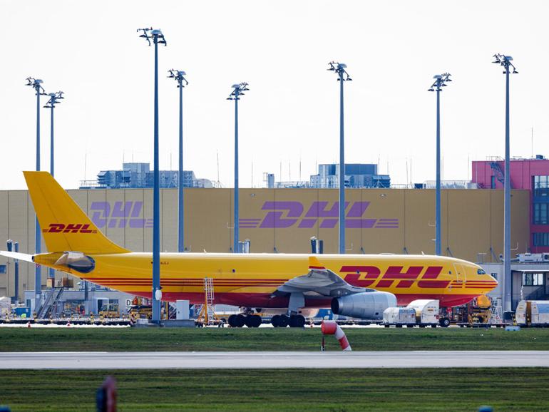 A DHL cargo plane on the tarmac at Leipzig/Halle Airport on October 15, 2024 in Schkeuditz, Germany. 