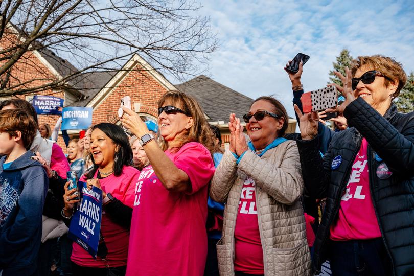 Democratic volunteers react to a speech by U.S. Rep. Debbie Dingell (D-Mich.) at a canvassing event in Novi, Mich., Nov. 3, 2024. 