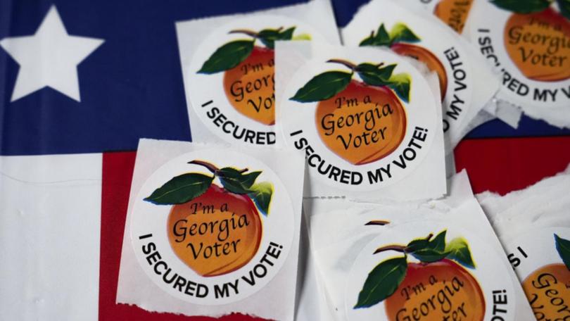 Two polling locations in Georgia were closed for half an hour following bomb threats. (AP PHOTO)