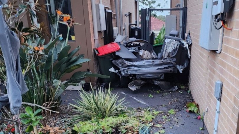 The back half of the teen’s car was found down the side of a nearby house.