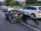 An 18-year-old driver is lucky to have escaped unharmed after the back half of his car was severed in a crash at Baulkham Hills.