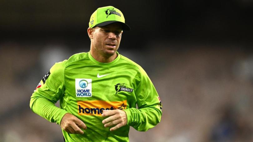 David Warner jogs on to the field for the Sydney Thunder.